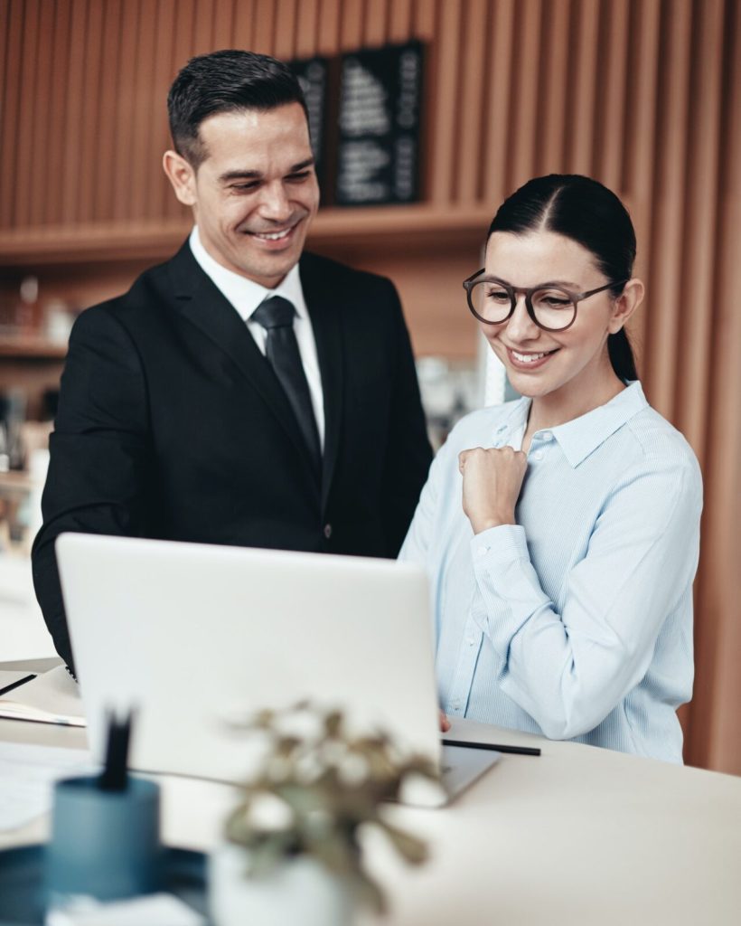 two-smiling-businesspeople-using-a-laptop-together-in-an-office.jpg two-smiling-businesspeople-using-a-laptop-together-in-an-office.jpg